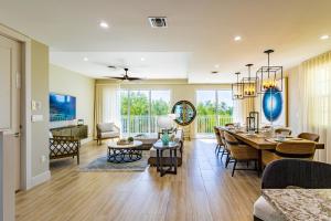 a dining room and living room with a dining table at Sea Haven #38 in Key Largo
