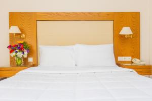 Postel nebo postele na pokoji v ubytování Hotel Aspassia