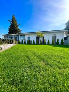 a large white building with a large yard at Dalaman Airport AliBaba Hotel in Dalaman