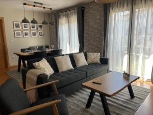 a living room with a couch and a table at Apartamento Blascondo in Broto