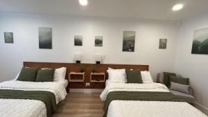 Postel nebo postele na pokoji v ubytování Hygge Hus Hotel