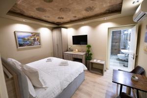 TV a/nebo společenská místnost v ubytování 4R Colombo Hotel