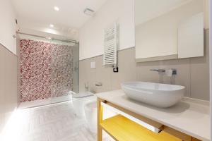 a bathroom with a white sink and a toilet at Gioì Hotel Sorrento in Piano di Sorrento +103 photos