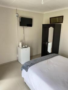 Postel nebo postele na pokoji v ubytování Princia Guest House