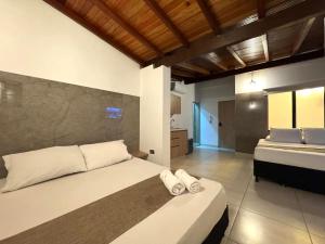 a bedroom with two beds in a room at Urbanity Living in Medellín