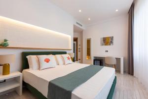 Postel nebo postele na pokoji v ubytování Gioì Hotel Sorrento
