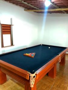 a pool table in a room with at Kampu Wasi - Casa de Campo in Pachacamac