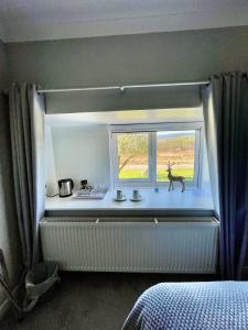 Postel nebo postele na pokoji v ubytování Lundie View B & B