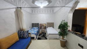 Postel nebo postele na pokoji v ubytování Appartement 7 min de l'aéroport de Marrakech