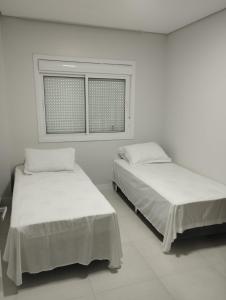 Uma cama ou camas num quarto em Pousada Onix