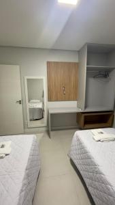 Uma cama ou camas num quarto em Pousada Onix