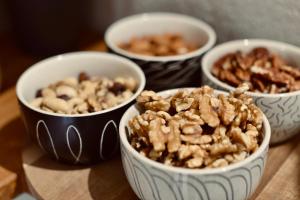 a group of four bowls of nuts on a table at Palermo Inn Boutique Arte in Palermo