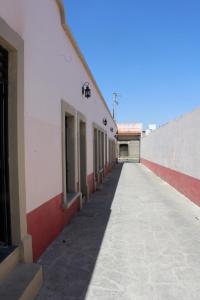 an empty hallway of a building with an alley at Lofts Sayula Independencia in Sayula