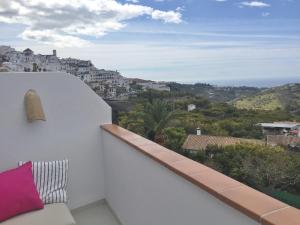 a balcony with a view of a city at Apartment Joaquin in Frigiliana