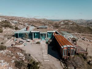 an aerial view of a house on a hill at Eco-Suite Estación Penitente in Minas
