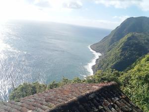 a view of the ocean from a roof at Basaltic House Pedreira in Lomba da Pedreira