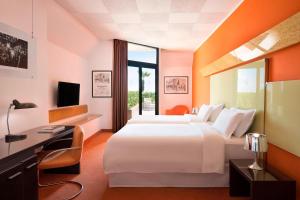 Un ou plusieurs lits dans un hébergement de l'établissement Four Points by Sheraton Catania Hotel