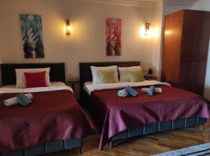 Postel nebo postele na pokoji v ubytování Urban Boutique Hotel