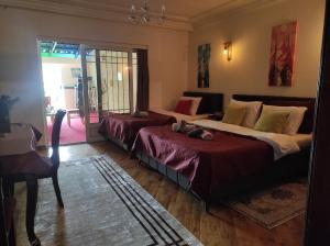 Postel nebo postele na pokoji v ubytování Urban Boutique Hotel