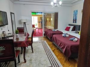 Postel nebo postele na pokoji v ubytování Urban Boutique Hotel