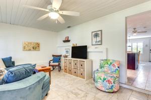 a living room with a couch and a tv at Englewood Bungalow 1 Mi to Beach Pets Welcome! in Englewood