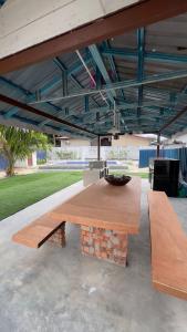 a wooden table with a bowl on top of it at Villa Alyana in Ipoh +12 photos