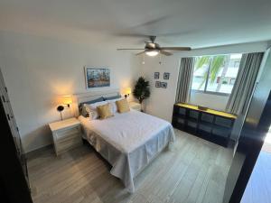 a bedroom with a bed and a ceiling fan at TERRA 1B CONDO - Nuevo Nayarit in Nuevo Vallarta +53 photos