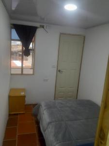 Postel nebo postele na pokoji v ubytování Hotel Mahoma