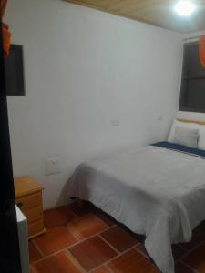 Postel nebo postele na pokoji v ubytování Hotel Mahoma