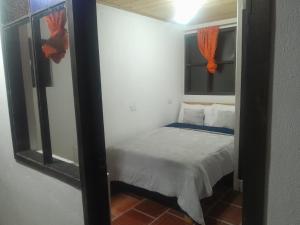 Postel nebo postele na pokoji v ubytování Hotel Mahoma