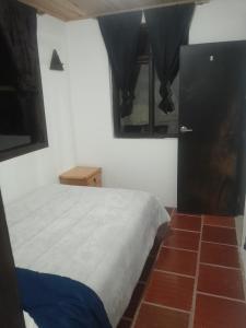 Postel nebo postele na pokoji v ubytování Hotel Mahoma