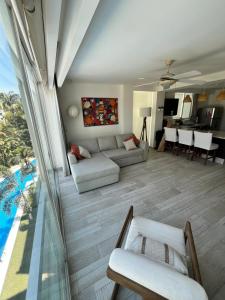 a living room with a couch and a table at TERRA 1B CONDO - Nuevo Nayarit in Nuevo Vallarta