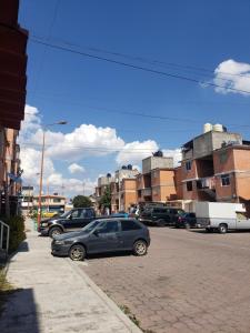 a car parked on the side of a city street at Departamento Jardín Magnolia in Apizaco