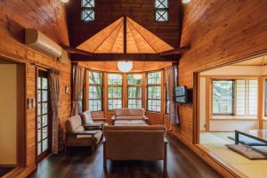 TV a/nebo společenská místnost v ubytování Izumigo AMBIENT Yatsugatake Cottage