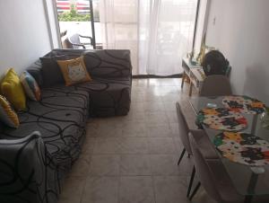 a living room with a couch and a table at @casa_grace Bienvenidos! in Cartagena de Indias +4 photos