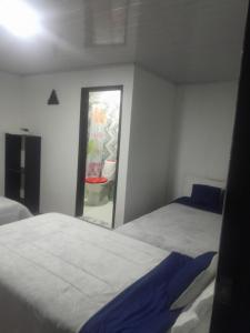 Postel nebo postele na pokoji v ubytování Hotel Mahoma
