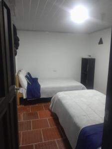 Postel nebo postele na pokoji v ubytování Hotel Mahoma