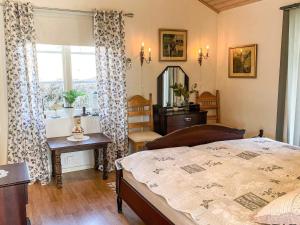 a bedroom with a bed and a window at 3 person holiday home in ÖDSMÅL in Ödsmål