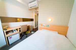 Postel nebo postele na pokoji v ubytování Super Hotel Asakusa