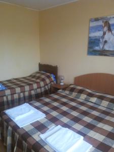 Postel nebo postele na pokoji v ubytování Casa Dalena