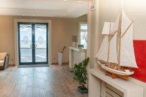 a model boat on a wall in a living room at Astoria Hotel in Vico Equense