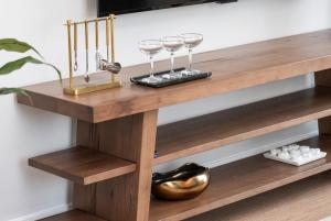 a wooden shelf with wine glasses on it at Luxury Apartments by Hyatus Boston Somerville in Somerville +61 photos