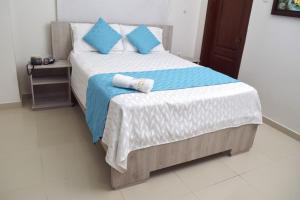 Postel nebo postele na pokoji v ubytování Hotel Dainner