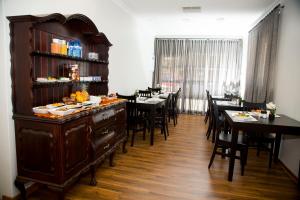 a dining room with tables and a bar with food on it at Barney Barnato in Kimberley