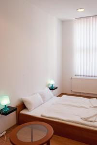 Broadway City Guesthouse客房内的一张或多张床位