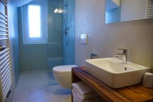Koupelna v ubytování Appartamenti Residence Pars