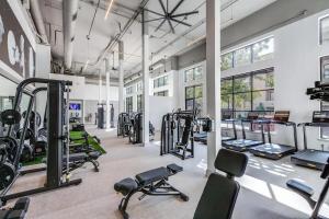 a gym with several treadmills and cardio machines at Stunning 1bd Apartment I Frisco near Dallas I Pool, Gym, Work Space in Frisco