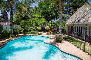 a swimming pool in the yard of a house at Barney Barnato in Kimberley