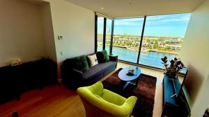 a living room with a couch and a table at Yarra Accommodation Private Apartment & Ensuite Room in Melbourne +54 photos