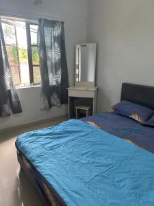Postel nebo postele na pokoji v ubytování Chengai homestay
